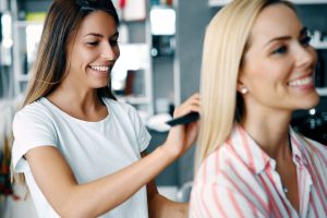Happy woman at the hair salon